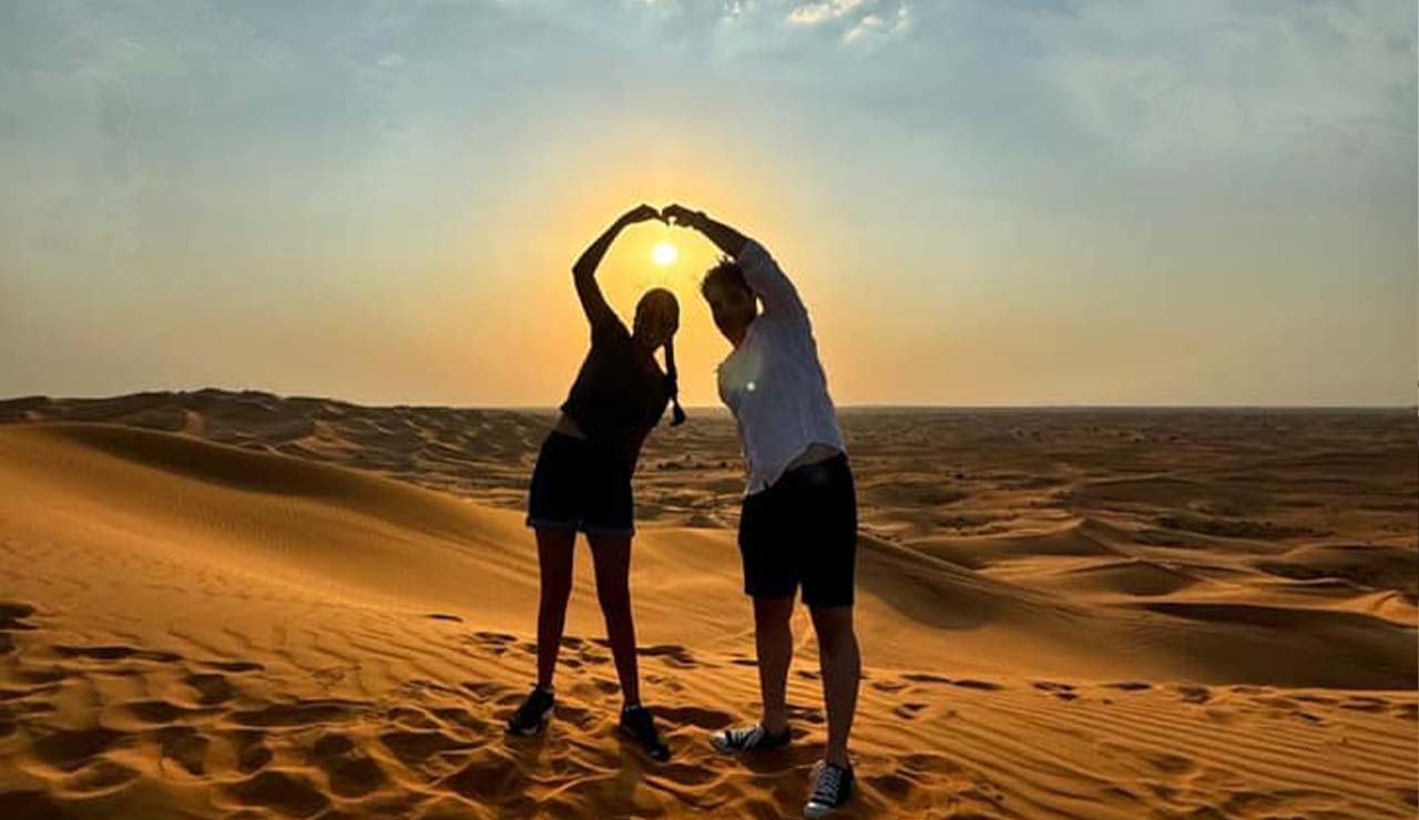 red sand family enjoying